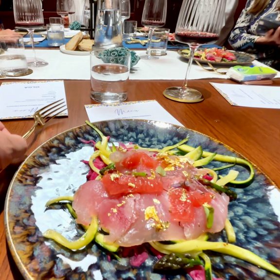 Fish starter with gold flakes served onboard motor yacht Olga, Aeonian Islands, Sicily